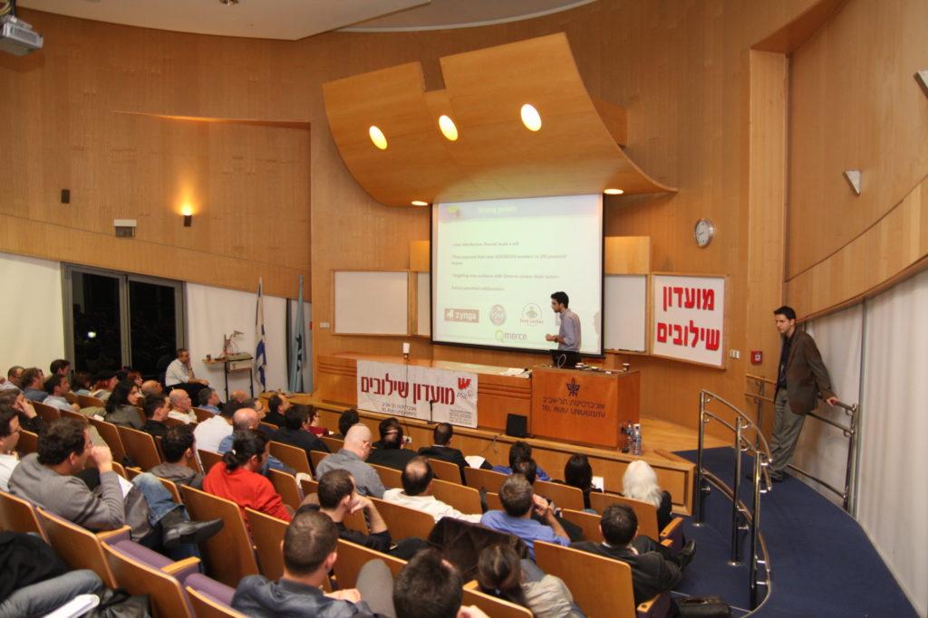 Moti Cohen, previously CEO of Qmerce, presenting live at the finals of the startup competition @ Tel Aviv University. On the right: Haggai Yedidya